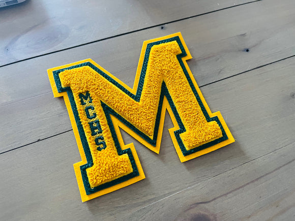 Personalized chenille varsity letters.
